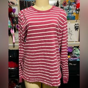 pink and white long sleeve shirt